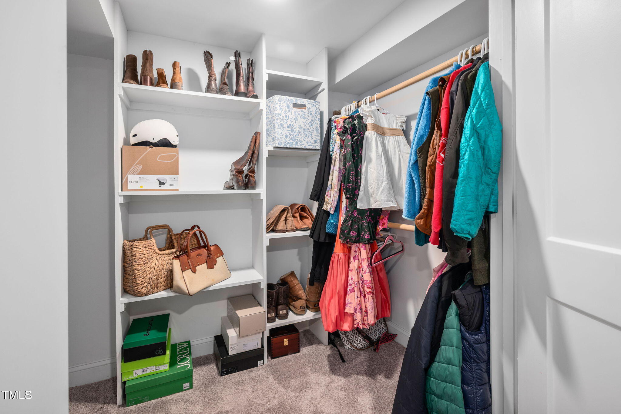 4808 Latimer Road Raleigh, NC 27609 - Photo 24 of 39 a view of walk in closet with clothes and shoes