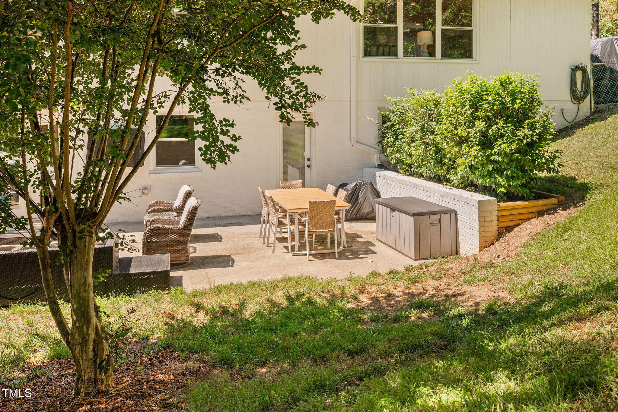 4808 Latimer Road Raleigh, NC 27609 - Photo 33 of 39 a view of a house with backyard and sitting area