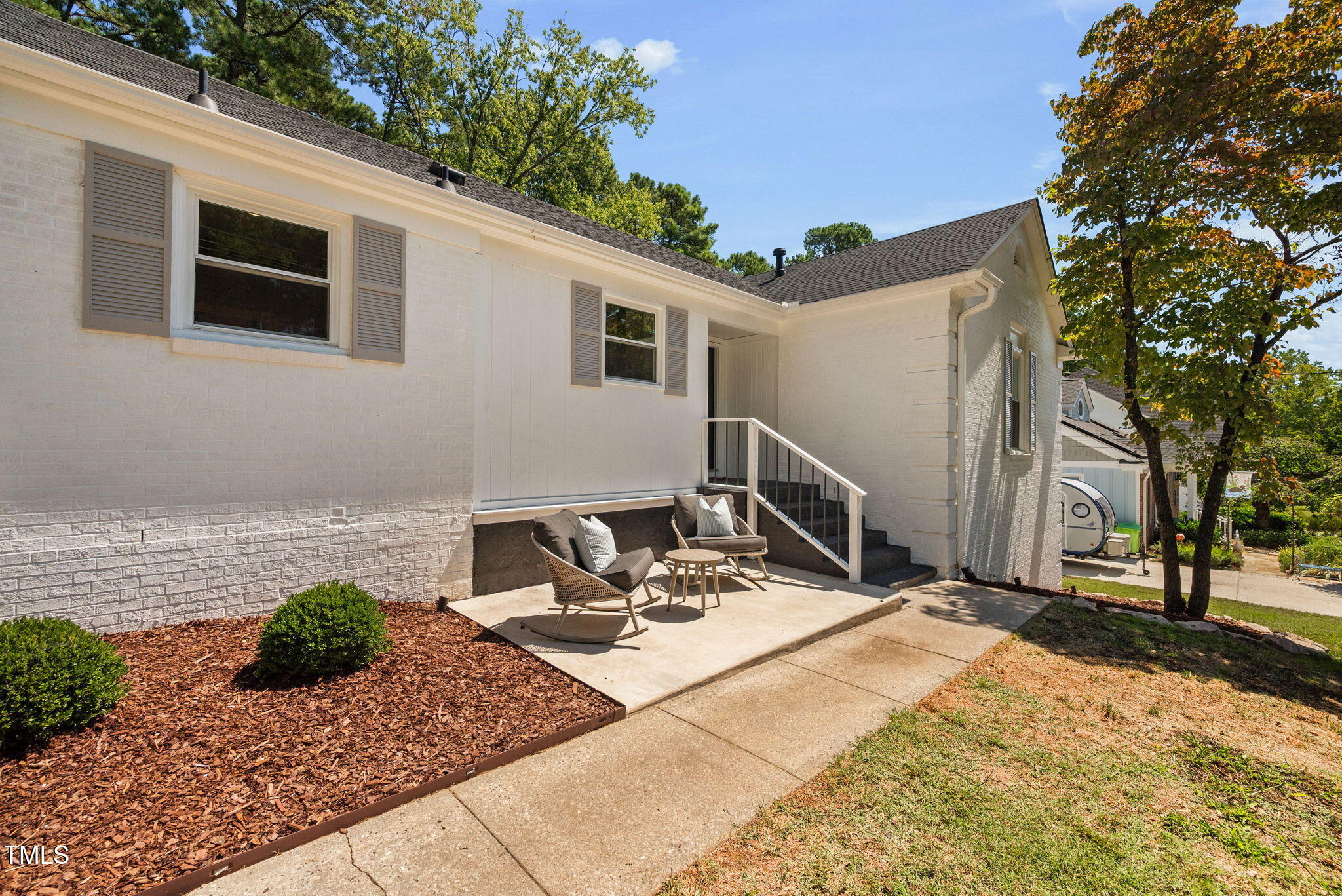 4808 Latimer Road Raleigh, NC 27609 - Photo 3 of 39 a view of a patio with chair and tables