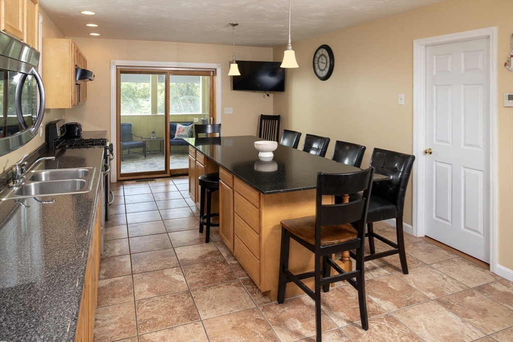 67 Newport Road Hull, MA 02045 - Photo 7 of 26 a view of a dining room with furniture