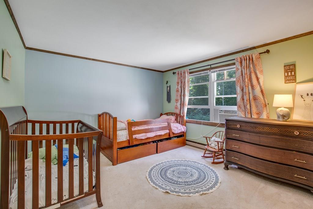 81 Newbury Road Rowley, MA 01969 - Photo 22 of 25 a bedroom with furniture and a window