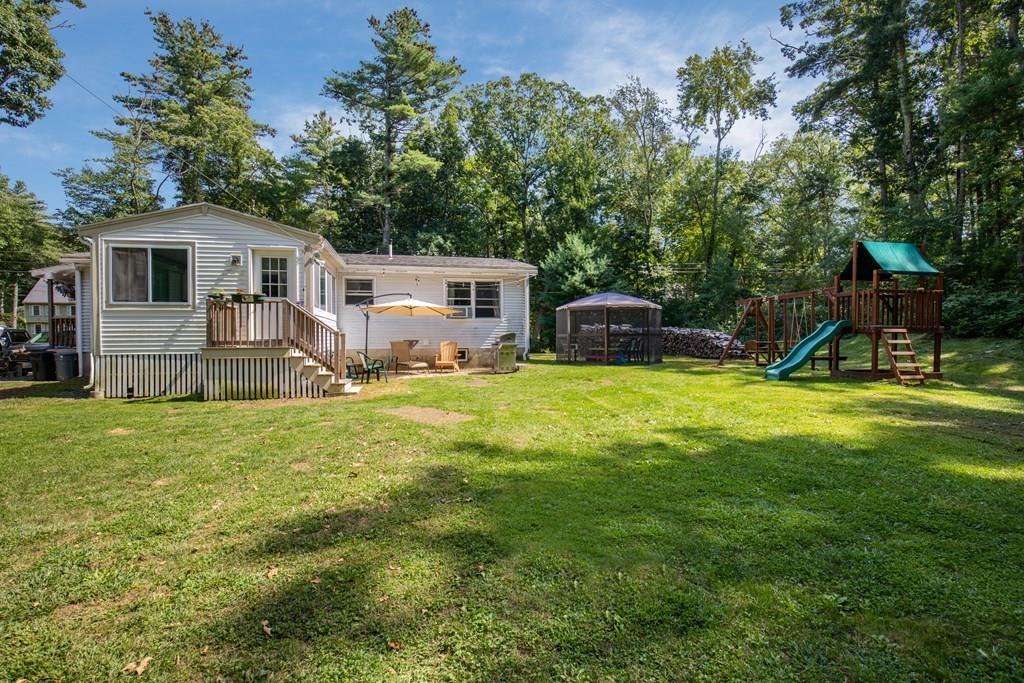 81 Newbury Road Rowley, MA 01969 - Photo 3 of 25 a view of a house with backyard and sitting area