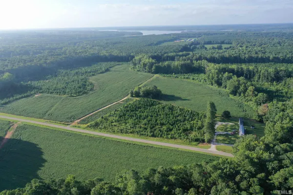 a view of a green field with an outdoor space