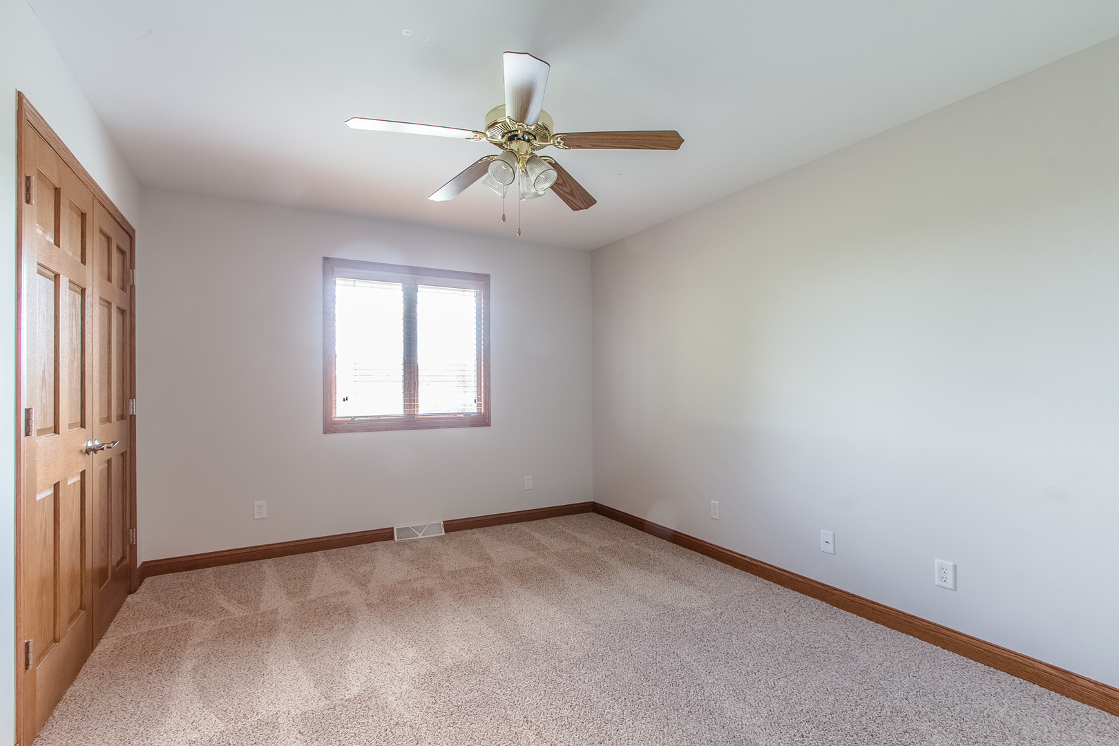 18802 West Manhattan Road Elwood, IL 60421 - Photo 13 of 38 an empty room with windows and fan