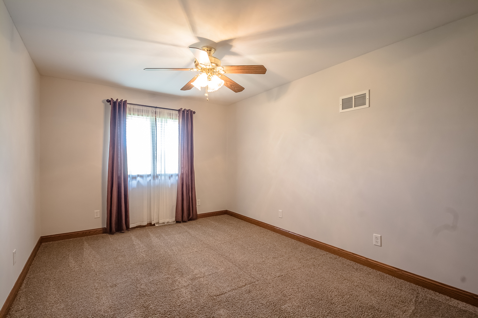 18802 West Manhattan Road Elwood, IL 60421 - Photo 15 of 38 an empty room with windows and fan