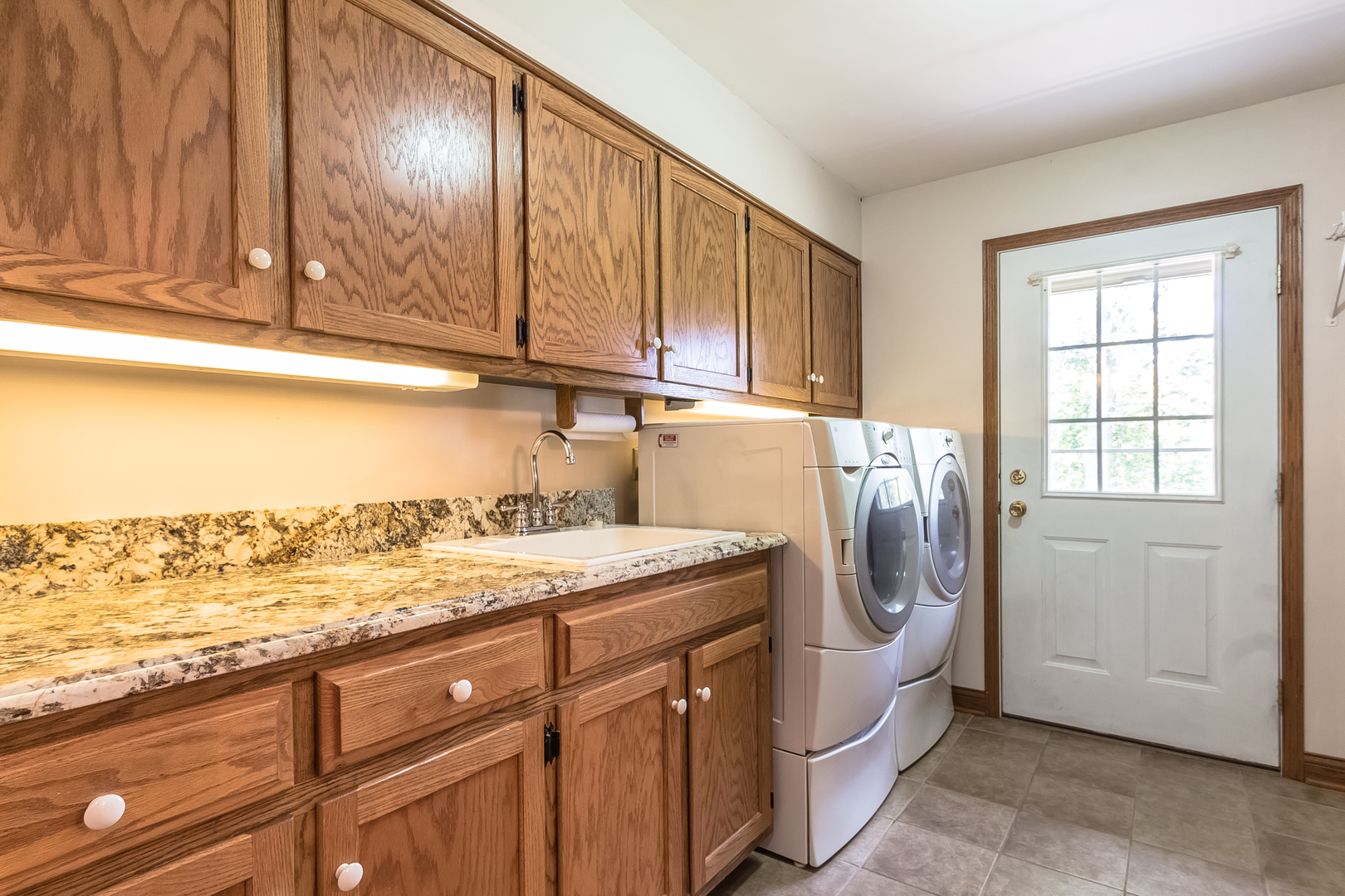 18802 West Manhattan Road Elwood, IL 60421 - Photo 28 of 38 a utility room with granite countertop cabinets washer and dryer