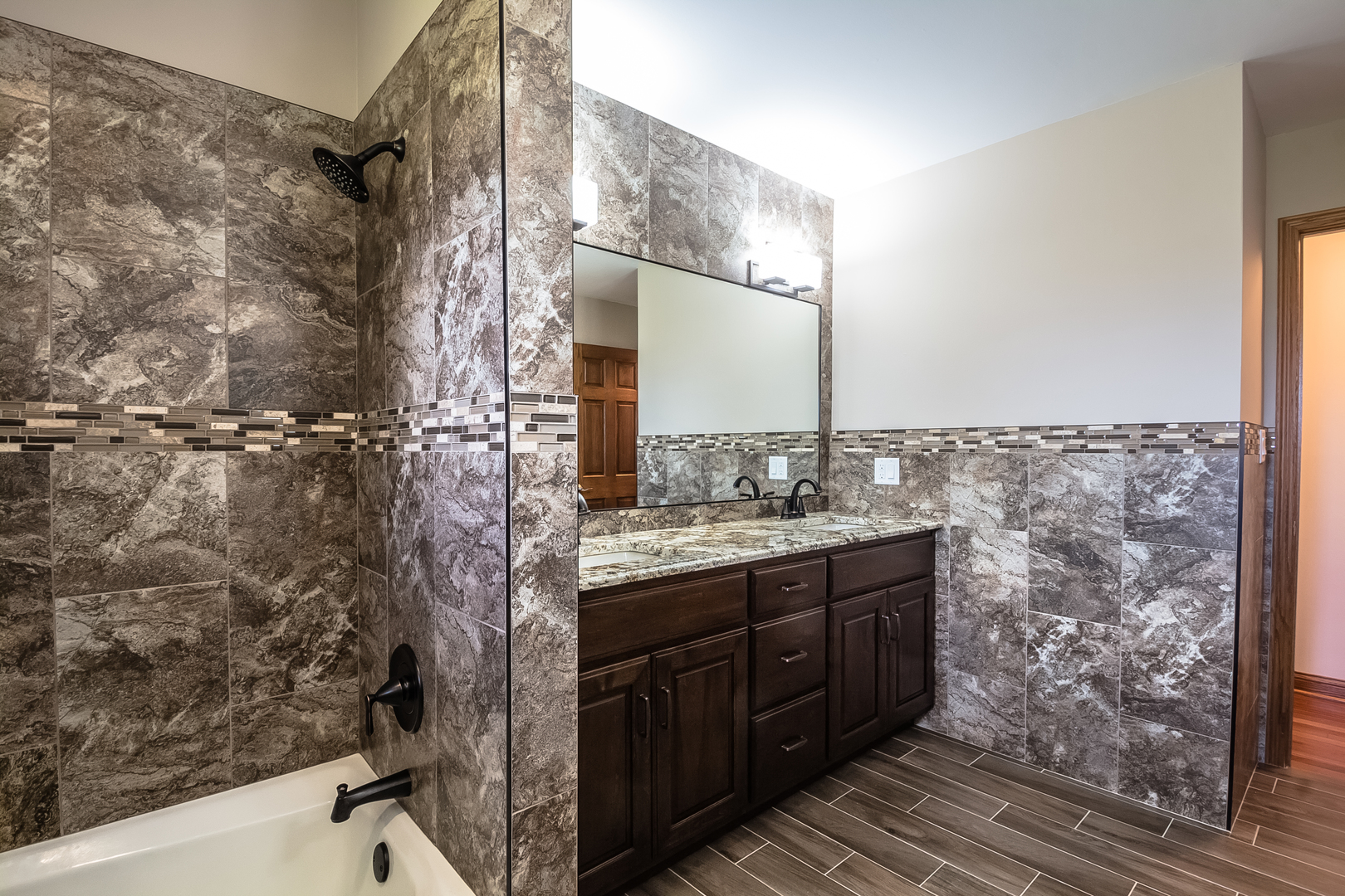 18802 West Manhattan Road Elwood, IL 60421 - Photo 29 of 38 a bathroom with a granite countertop sink a toilet and shower