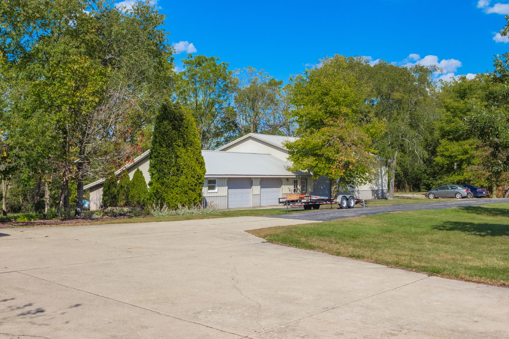 18802 West Manhattan Road Elwood, IL 60421 - Photo 6 of 38 a view of a house with a yard and large trees