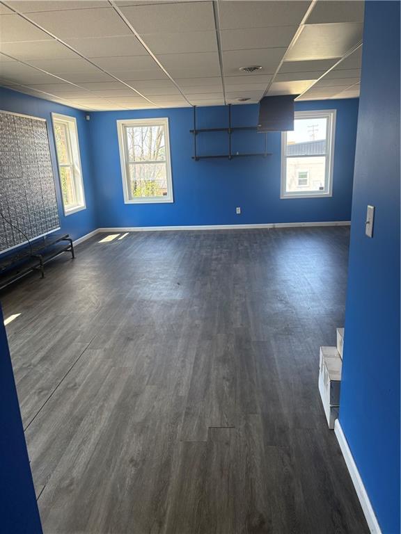 7710 Highway 30, Unit TOP Irwin, PA 15642 - Photo 5 of 9 wooden floor in an empty room with a window
