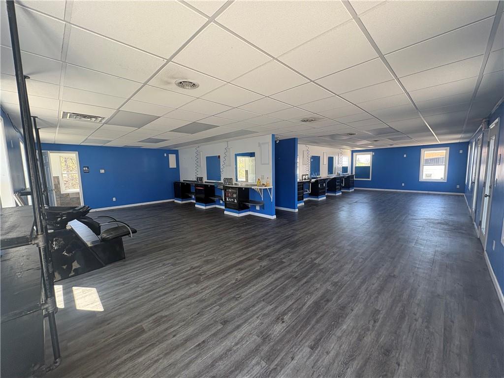 7710 Highway 30, Unit TOP Irwin, PA 15642 - Photo 8 of 9 a living room with furniture and a wooden floor