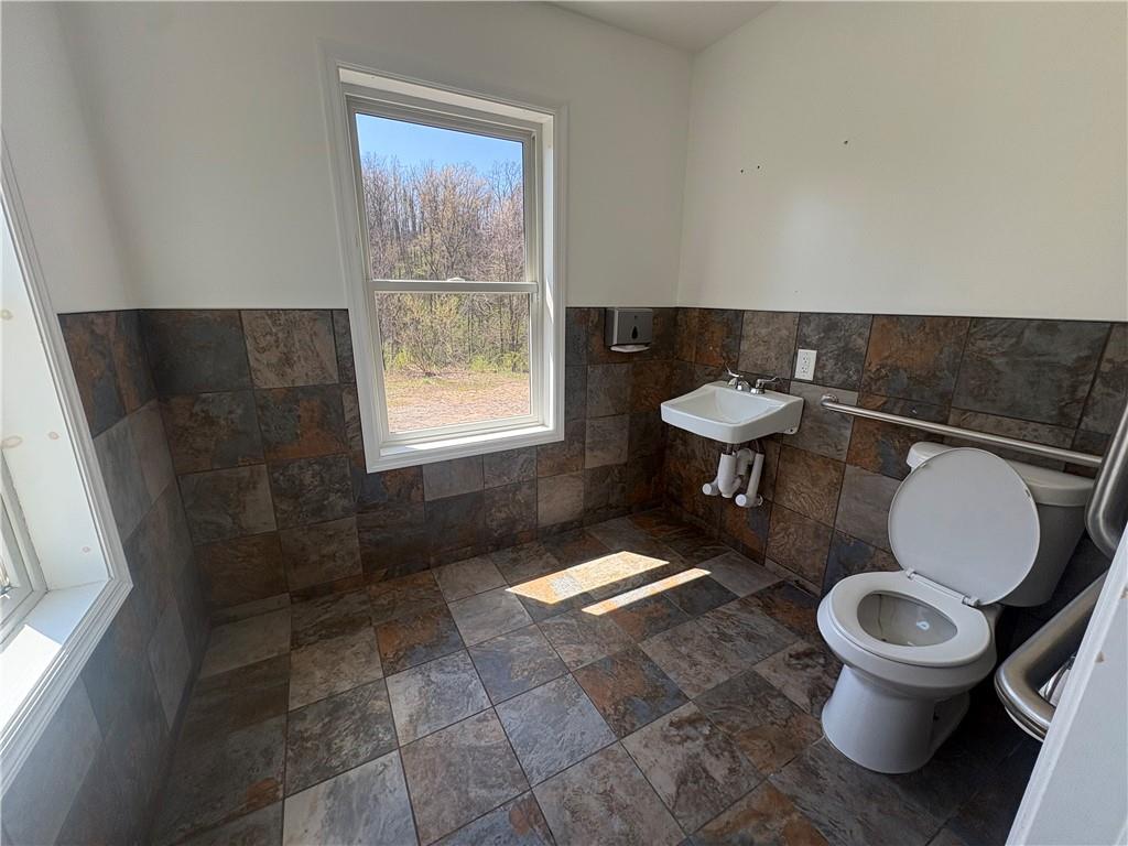 7710 Highway 30, Unit TOP Irwin, PA 15642 - Photo 9 of 9 a white toilet sitting next to a window