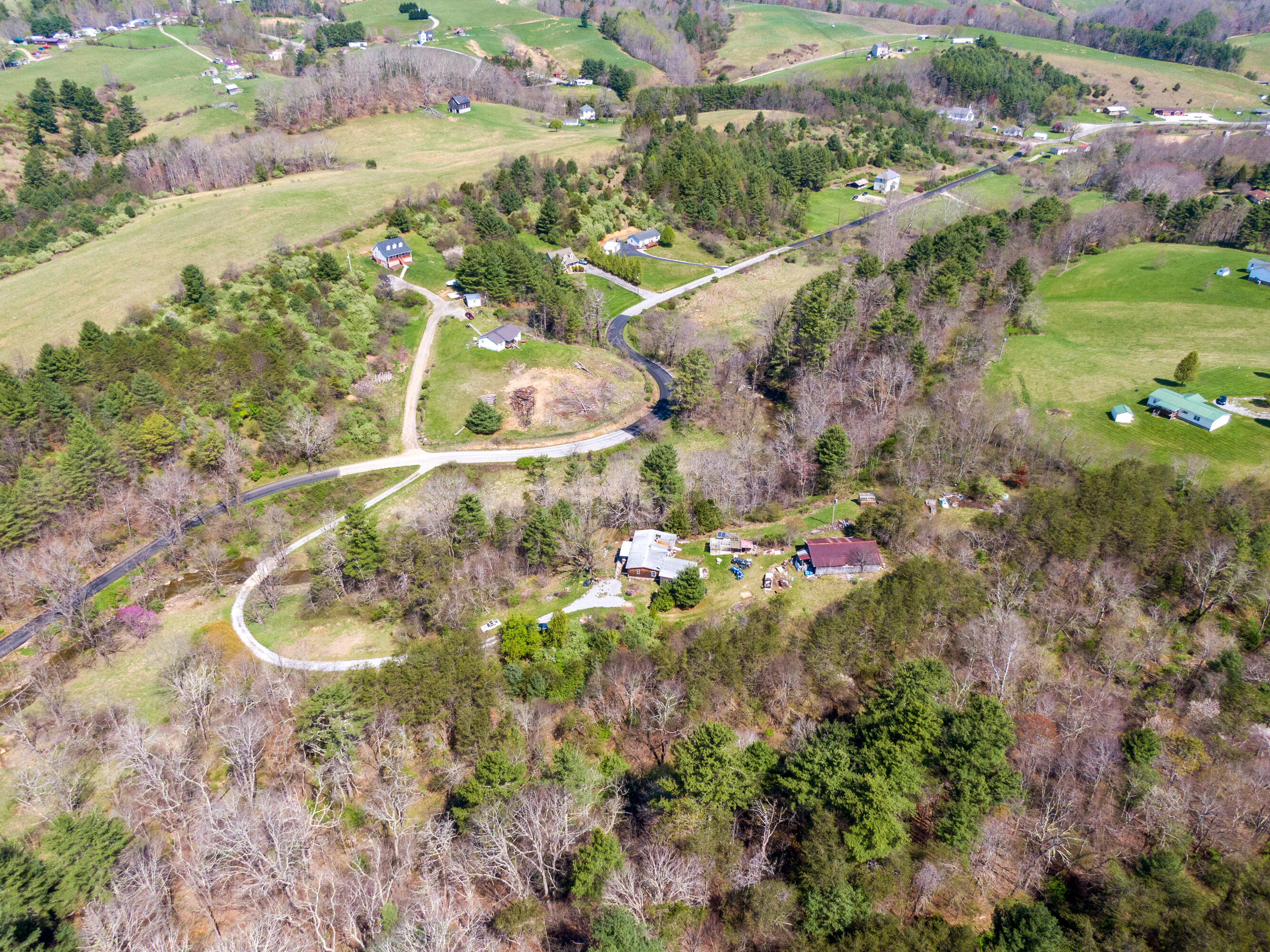 4610 Brush Creek Road Riner, VA 24149 - Photo 1 of 24 a view of a lake with a mountain
