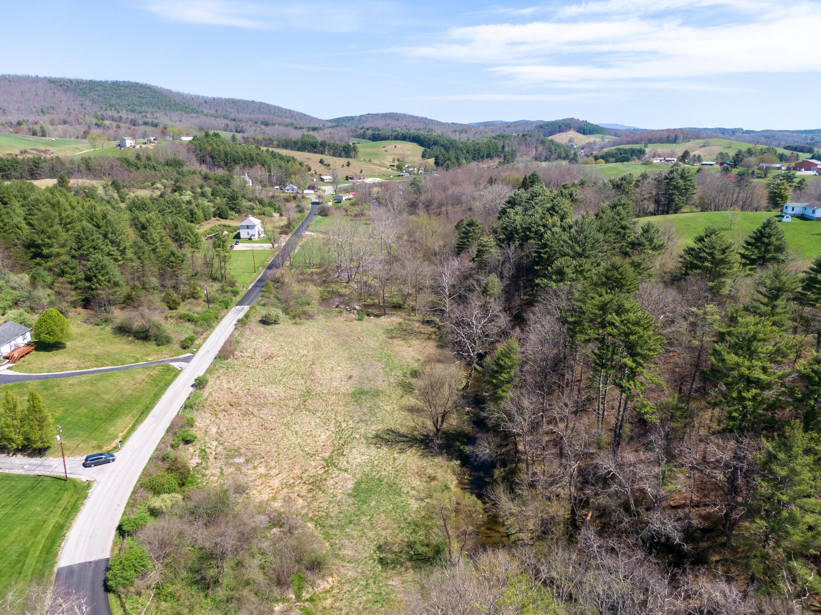 4610 Brush Creek Road Riner, VA 24149 - Photo 12 of 24 an aerial view of a house with a yard and lake view