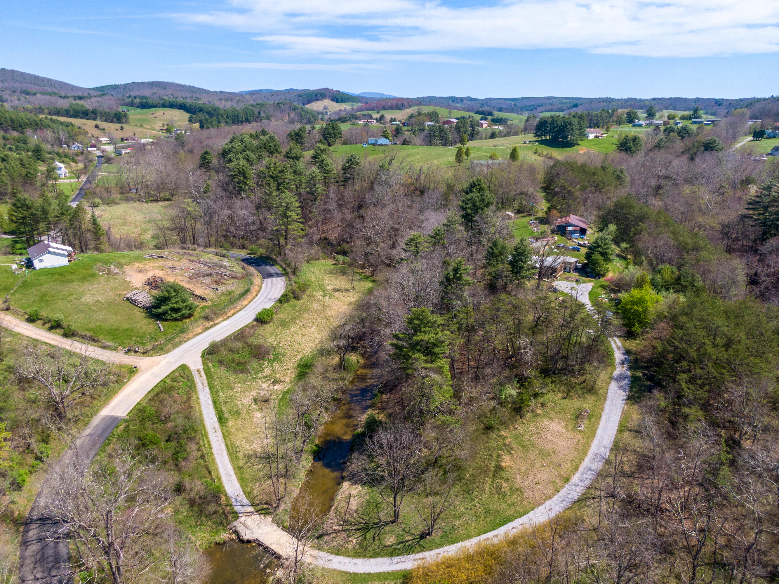 4610 Brush Creek Road Riner, VA 24149 - Photo 14 of 24 a view of a lake in middle of the house
