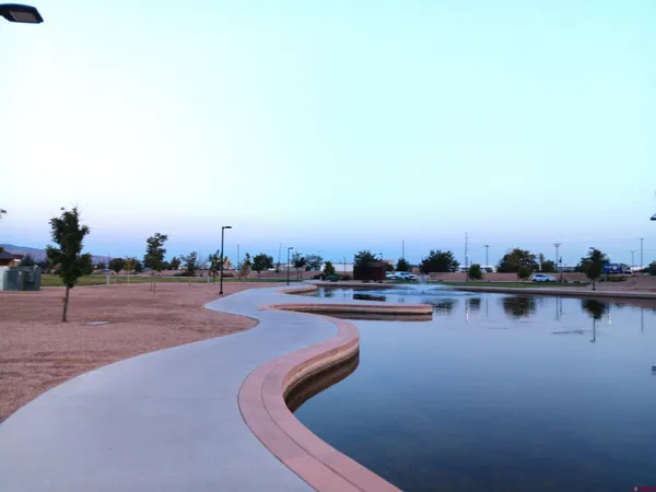a view of swimming pool outdoor seating and lake view