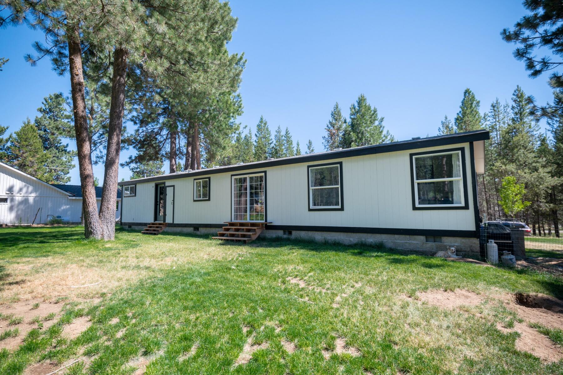 16990 Covina Road Bend, OR 97707 - Photo 45 of 56 a backyard of a house with table and chairs