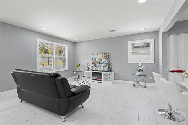 a living room with furniture and window