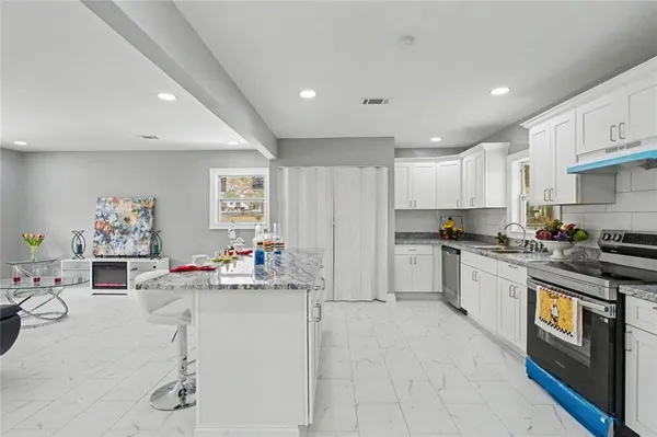 a kitchen with sink cabinets and window