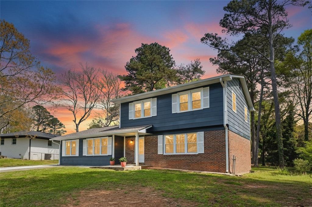 10664 Sandpiper Road Jonesboro, GA 30238 - Photo 2 of 40 a front view of a house with garden