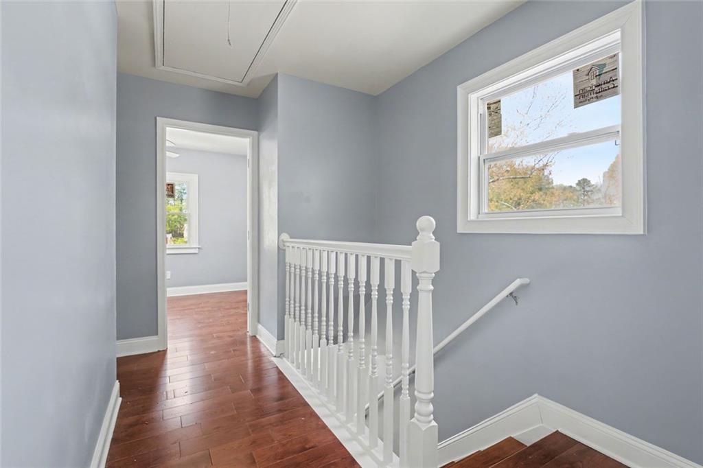 10664 Sandpiper Road Jonesboro, GA 30238 - Photo 26 of 40 a view of hallway with window and wooden floor