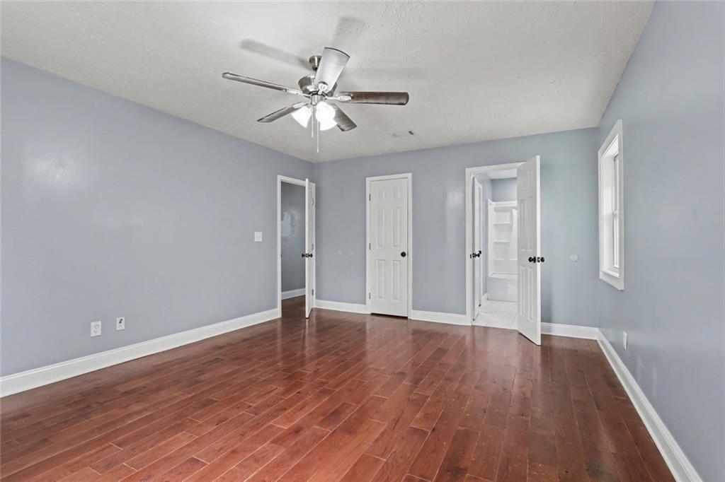 10664 Sandpiper Road Jonesboro, GA 30238 - Photo 32 of 40 a view of an empty room with wooden floor