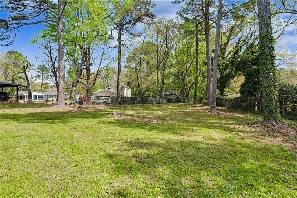 10664 Sandpiper Road Jonesboro, GA 30238 - Photo 35 of 40 a view of outdoor space with trees all around