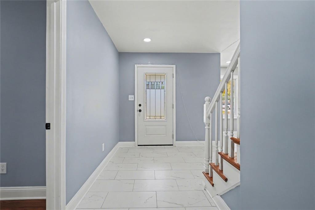 10664 Sandpiper Road Jonesboro, GA 30238 - Photo 7 of 40 a view of an entryway with staircase