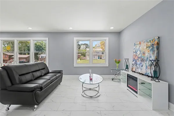 a living room with furniture and a window