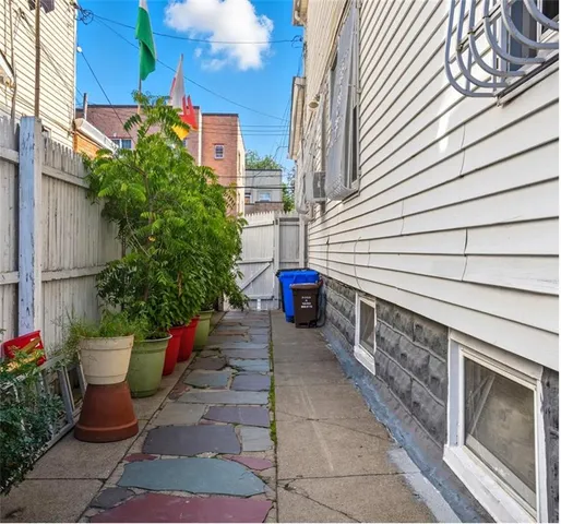 a view of a patio with furniture and potted plants