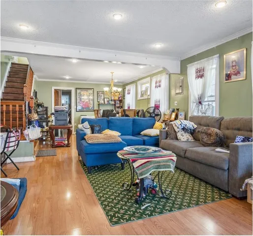 a living room with furniture and a rug
