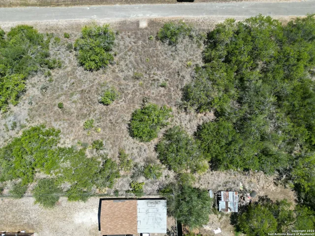 an aerial view of residential house with outdoor space