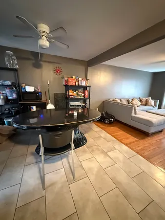 a kitchen with stainless steel appliances a refrigerator sink and cabinets