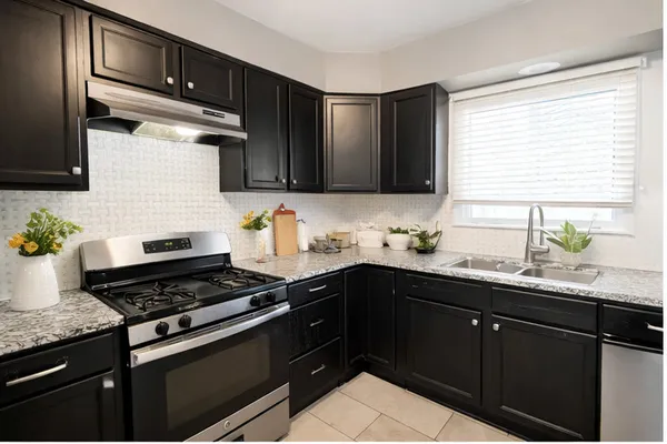 a kitchen with a cabinets and appliances