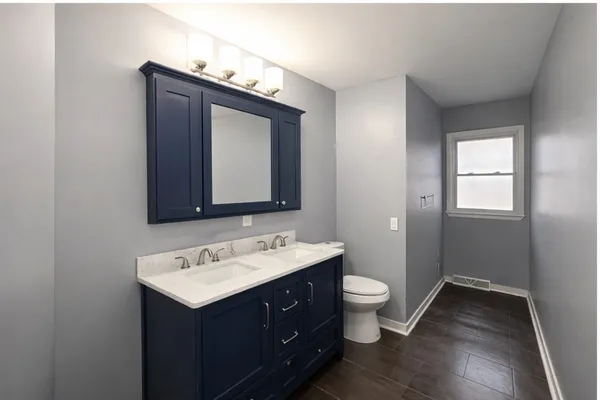 a bedroom with bed and a window