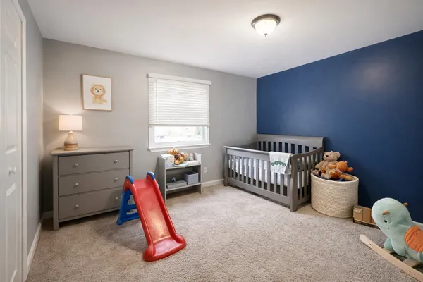 a spacious bedroom with a bed and a large walk in closet