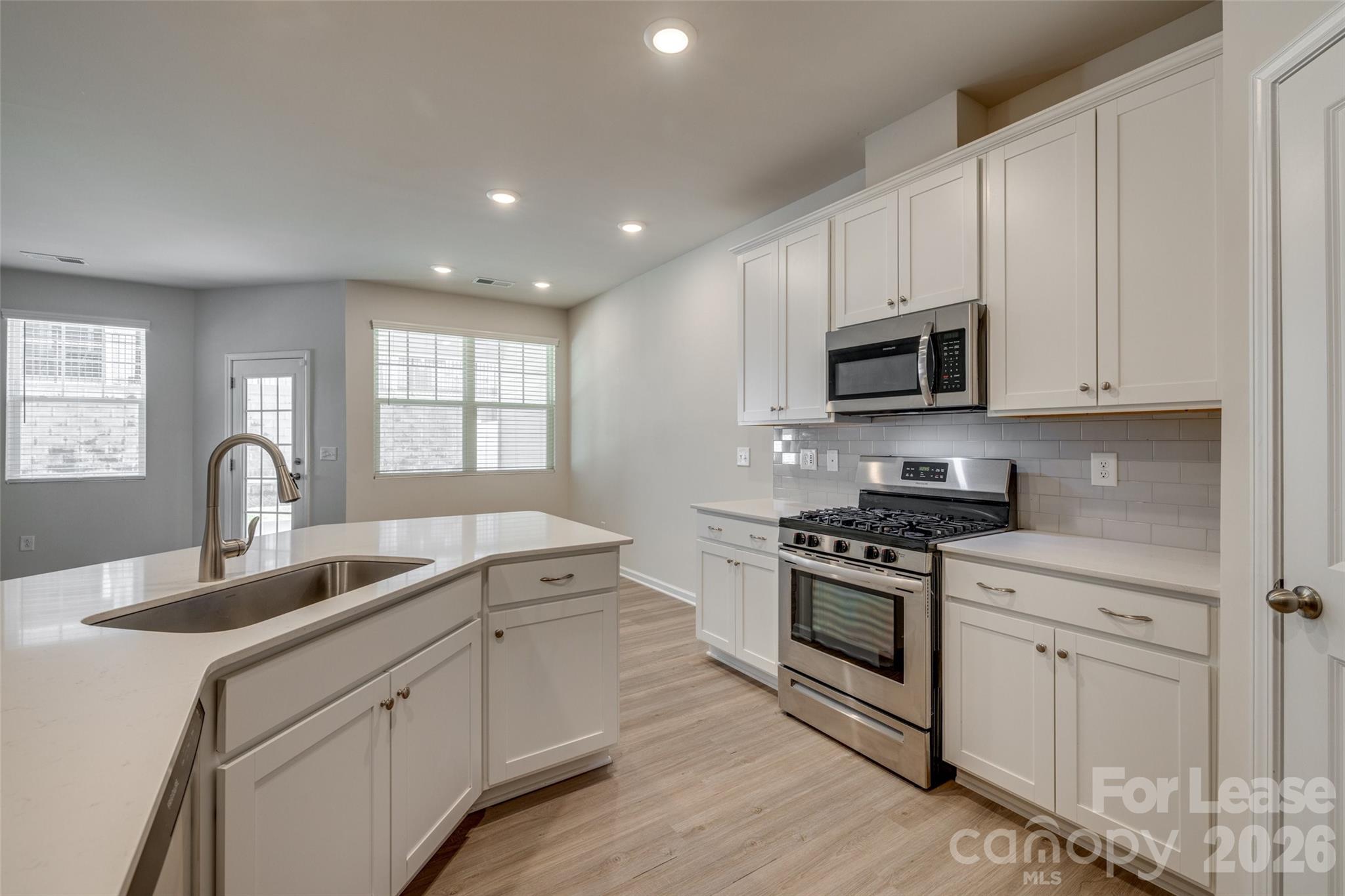 807 Gable Oak Lane Fort Mill, SC 29708 - Photo 7 of 39 a kitchen with appliances a sink and cabinets