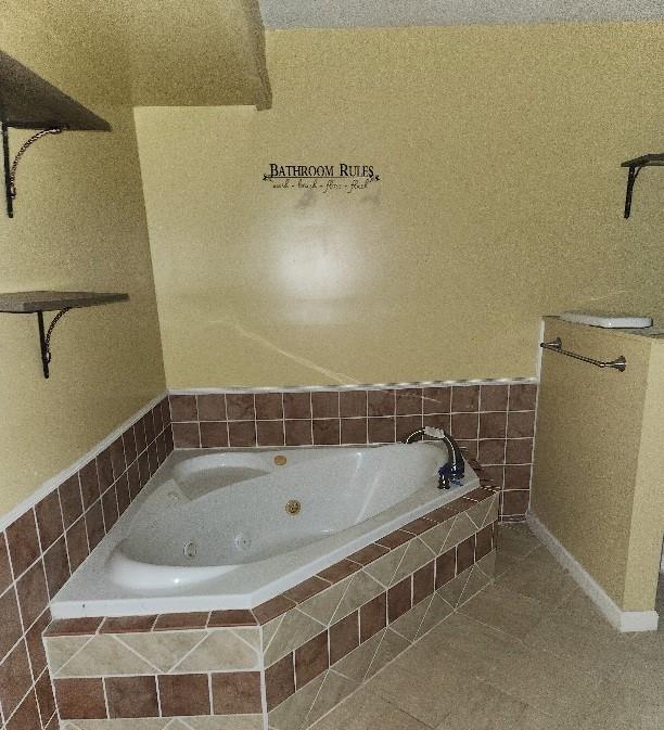 60 Zion Hill Road Marion, NC 28752 - Photo 15 of 19 a bathroom with a tub and a shower