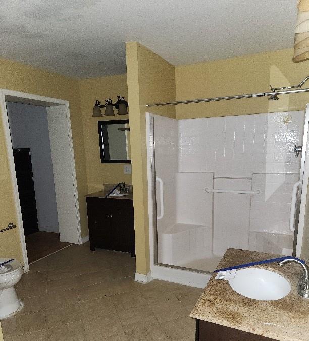 60 Zion Hill Road Marion, NC 28752 - Photo 16 of 19 a bathroom with a granite countertop shower sink and mirror