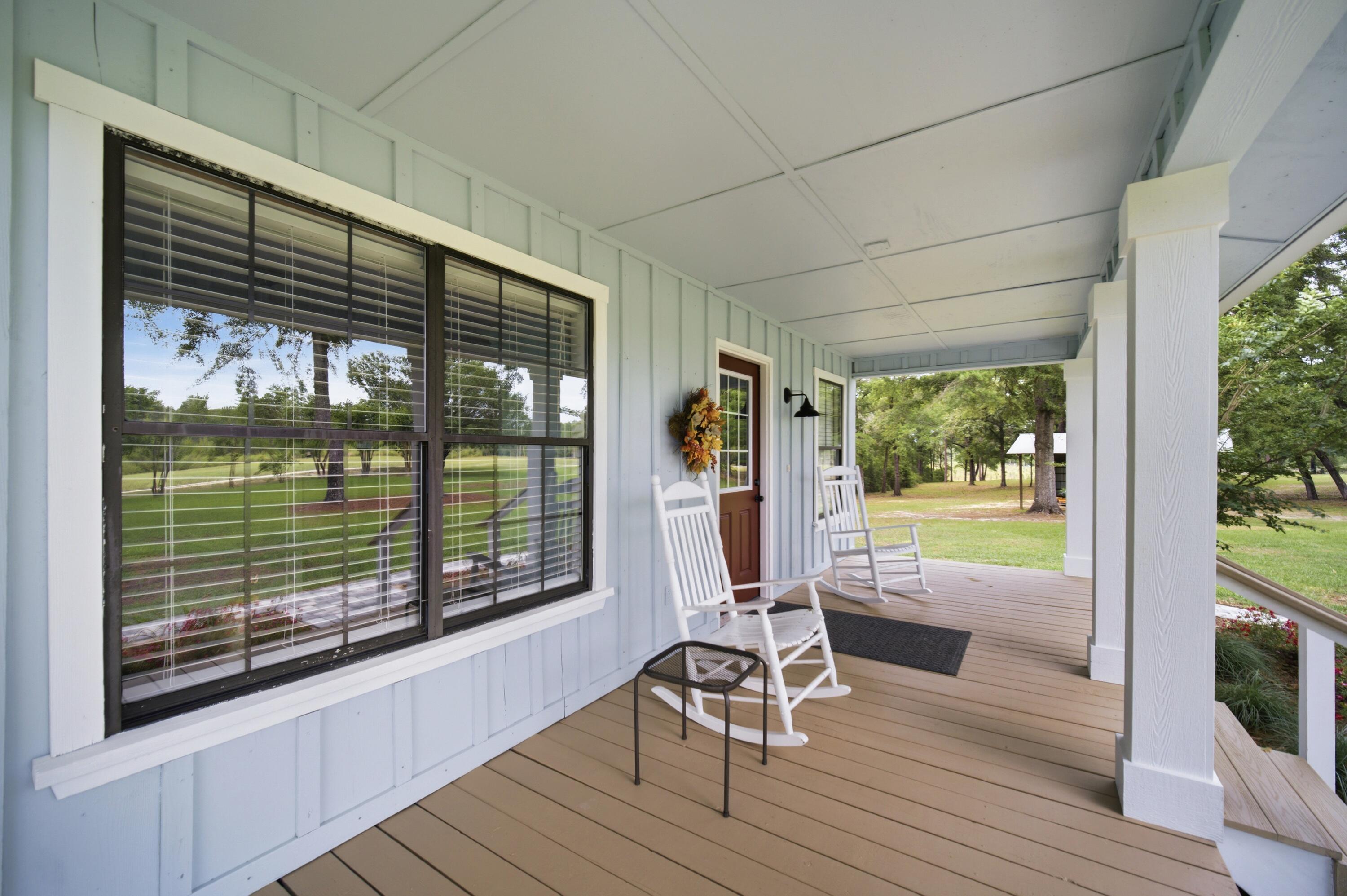 261 Wilkerson Road DeFuniak Springs, FL 32433 - Photo 41 of 76 a view of a room with a furniture and balcony