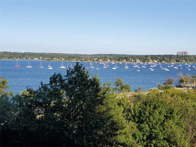 a view of parking garage with cars