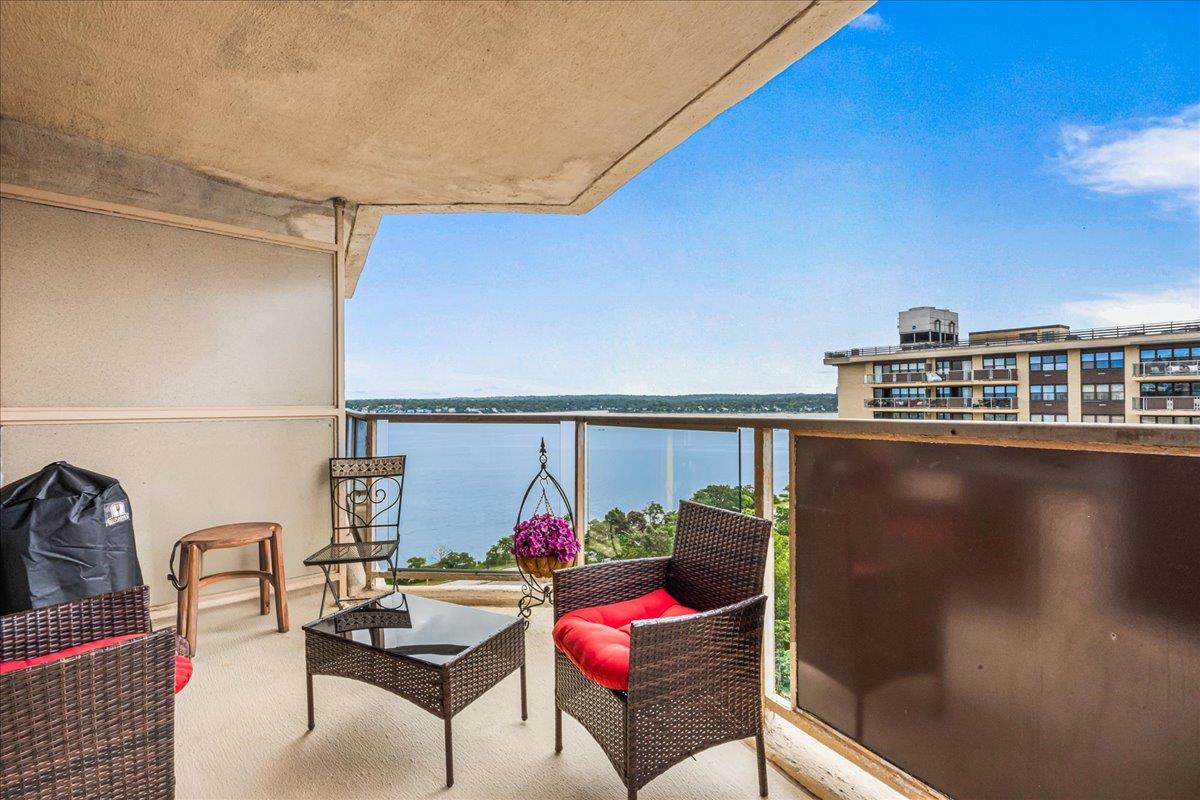 17-85 215th Street, Unit 16J Queens, NY 11360 - Photo 7 of 28 a view of a balcony with chairs