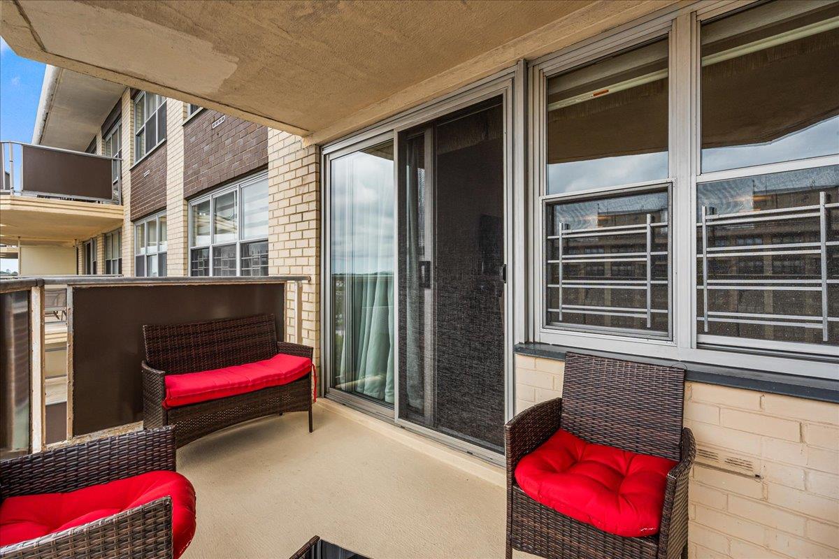 17-85 215th Street, Unit 16J Queens, NY 11360 - Photo 9 of 28 a bedroom with furniture and a window