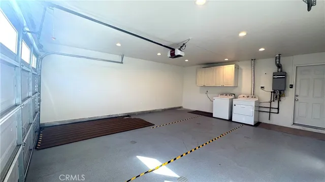 a view of a livingroom with furniture and a window