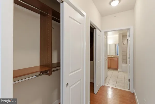 a view of a room with wooden floor