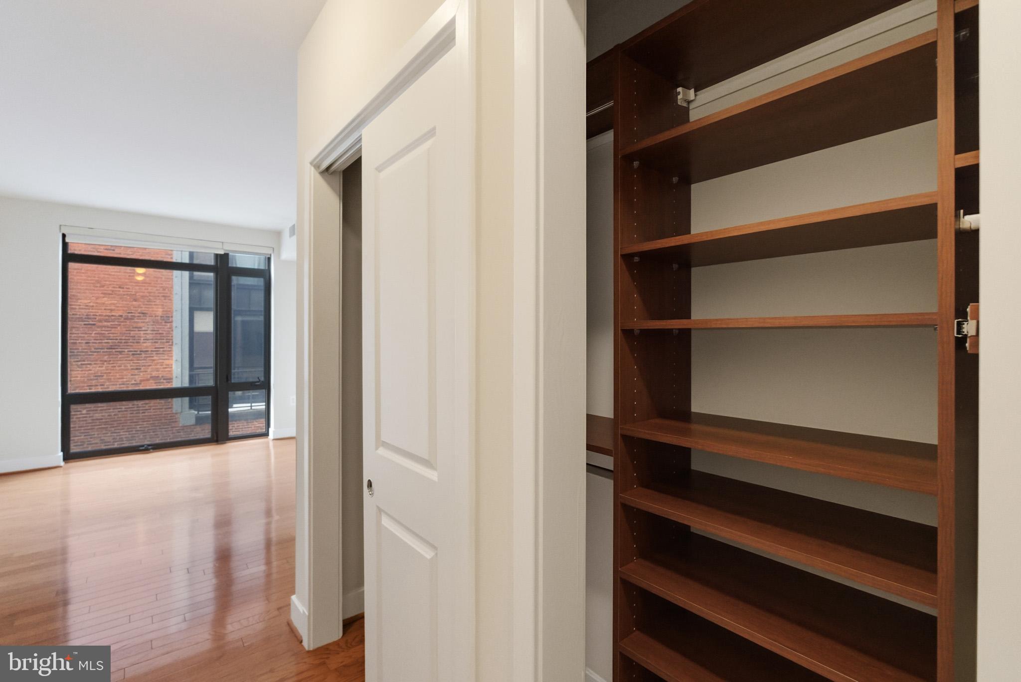 1211 13th Street Northwest, Unit 206 Washington, DC 20005 - Photo 13 of 22 a view of walk in closet with empty racks