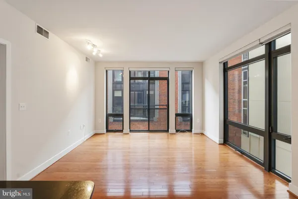 a view of an empty room with glass door