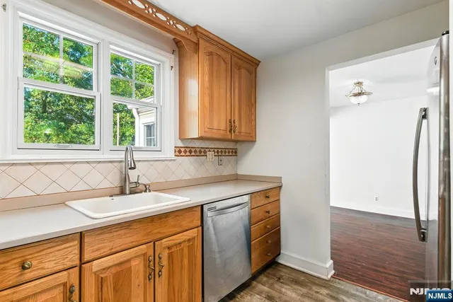 a bathroom with a sink and a window