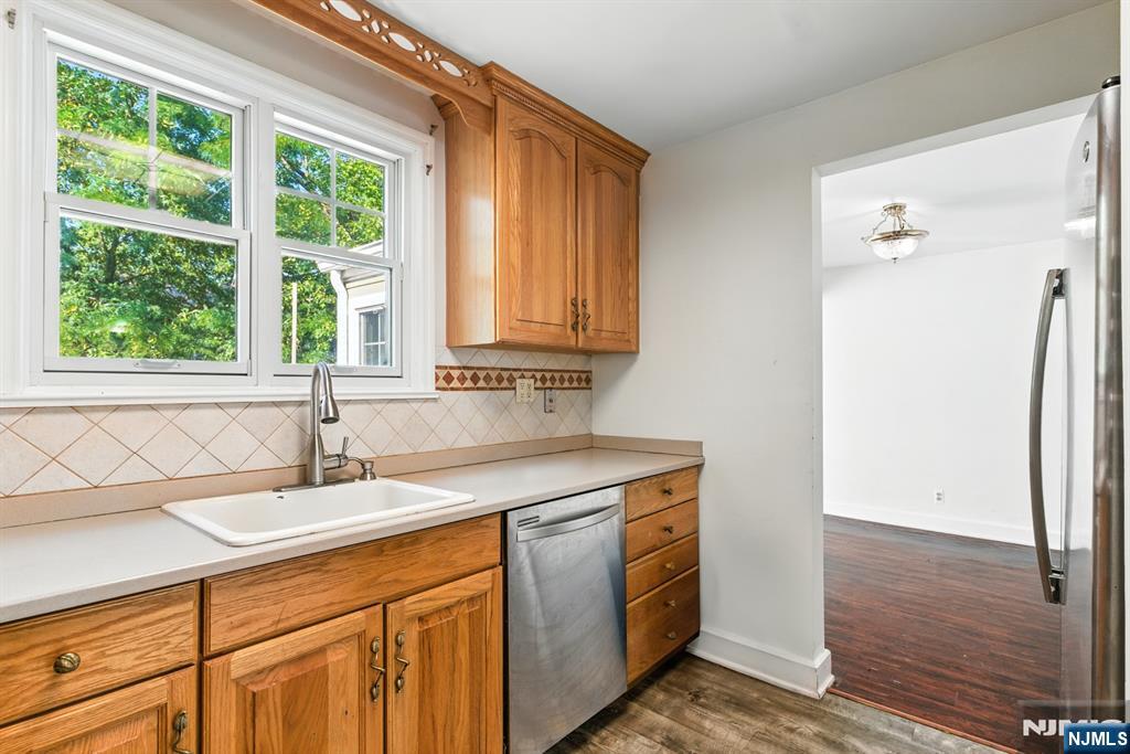42 Meadow Lane Bloomfield, NJ 07003 - Photo 13 of 37 a bathroom with a sink and a window