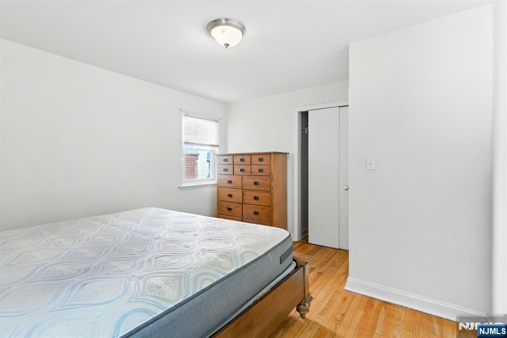 42 Meadow Lane Bloomfield, NJ 07003 - Photo 18 of 37 a bedroom with a bed and dresser