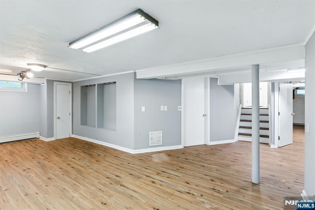 42 Meadow Lane Bloomfield, NJ 07003 - Photo 25 of 37 a view of a livingroom with wooden floor